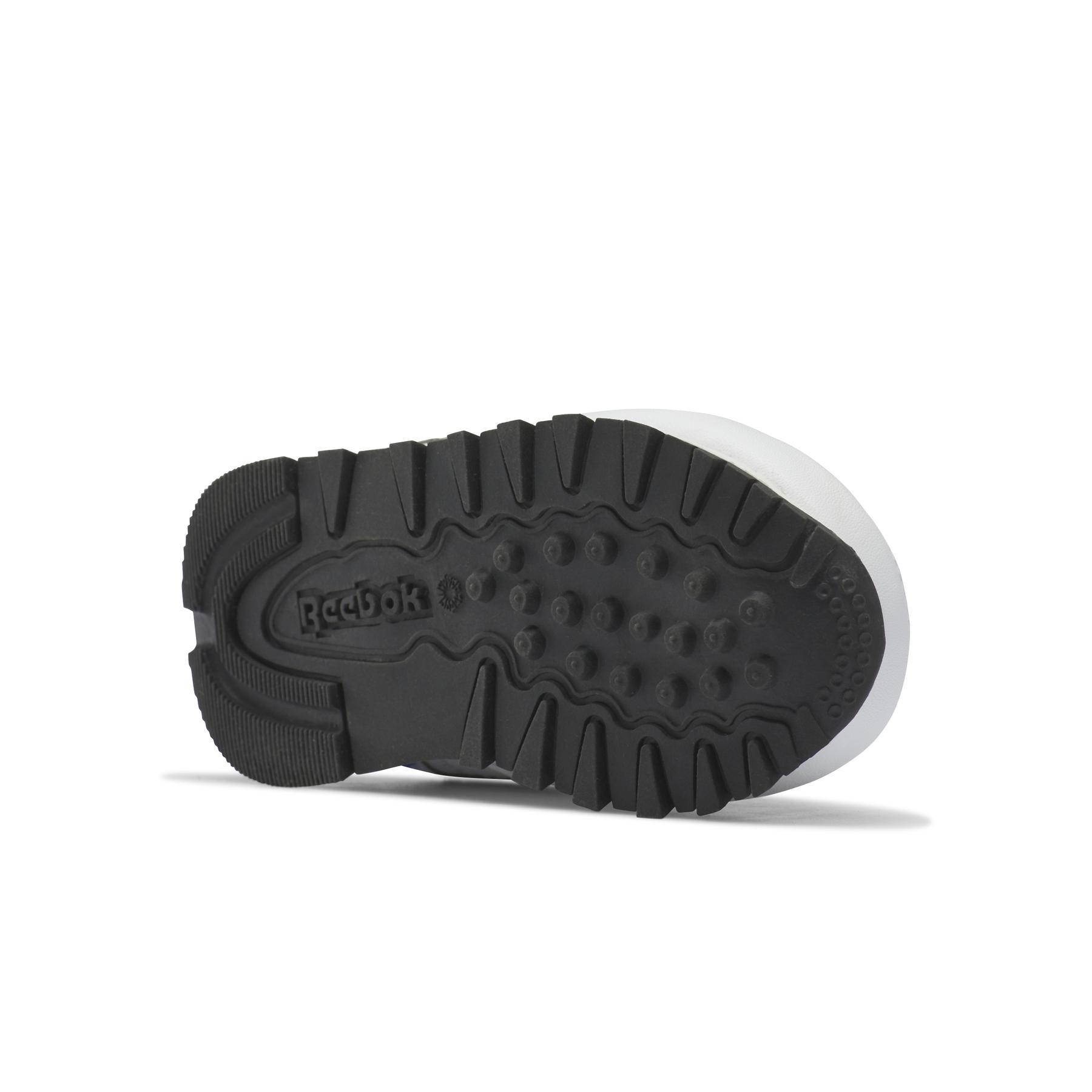 product/r/e/reebok_hr1067_3_footwear_photography_bottom_view_white.jpg