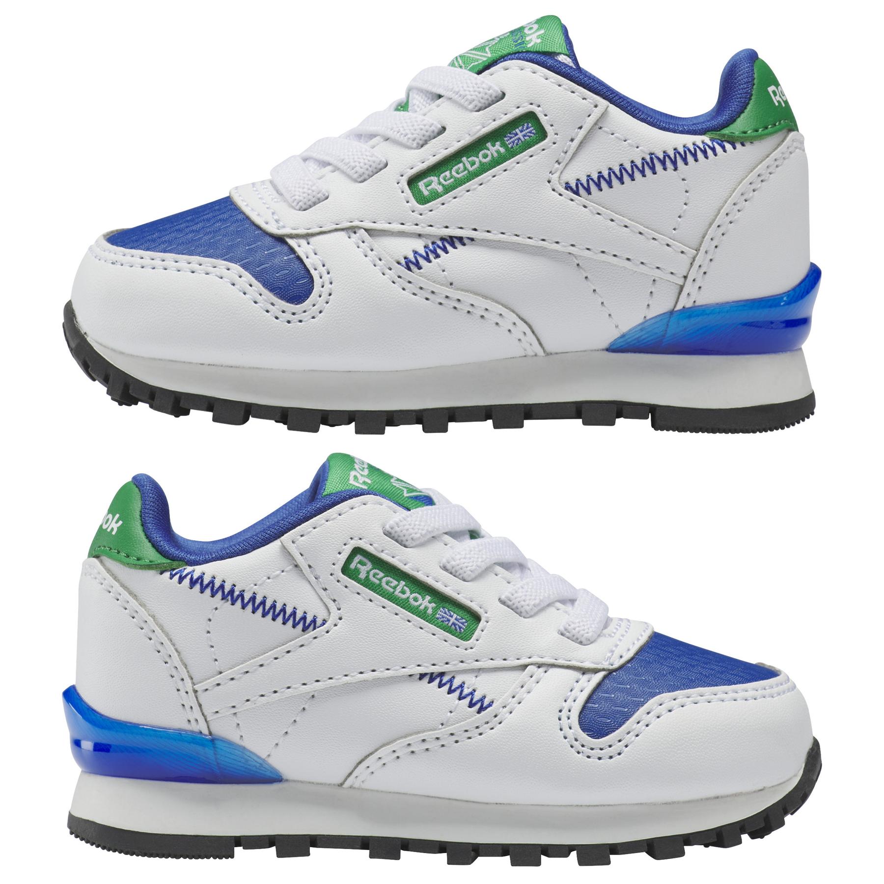 product/r/e/reebok_hr1067_9_footwear_photography_mirrored_pair_view_white.jpg